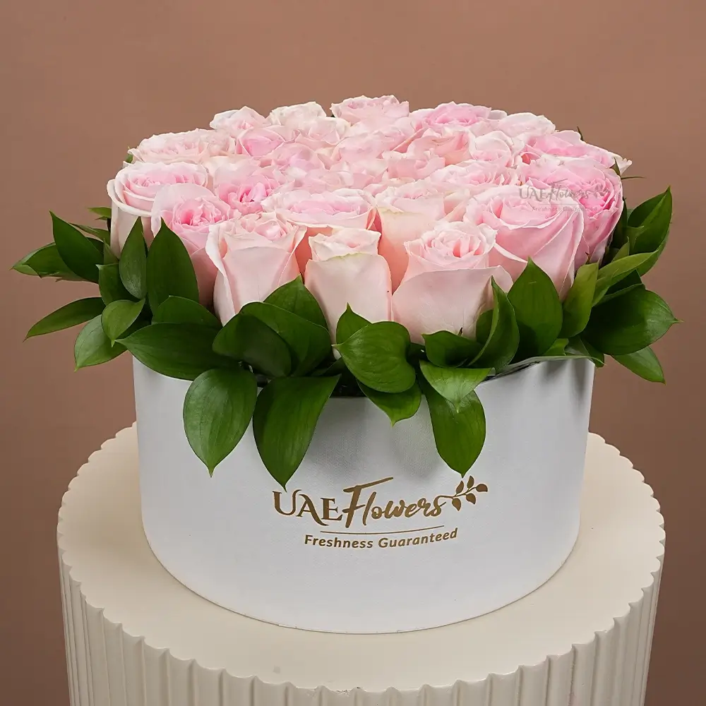 30 pink roses with green fillers in a white round box.
