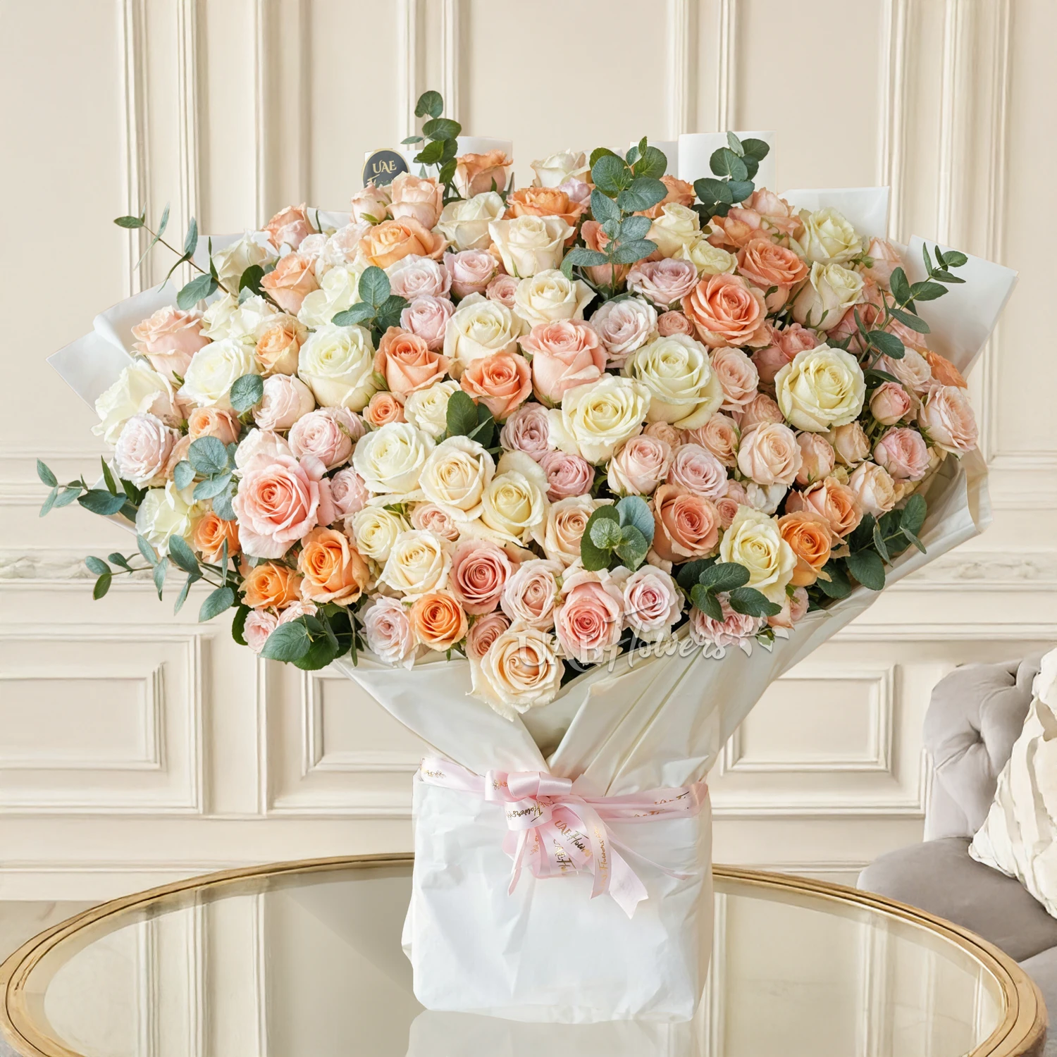 Bouquet of 20 pink spray roses and 40 mixed pastel coloured roses with green fillers and tied with ribbons.