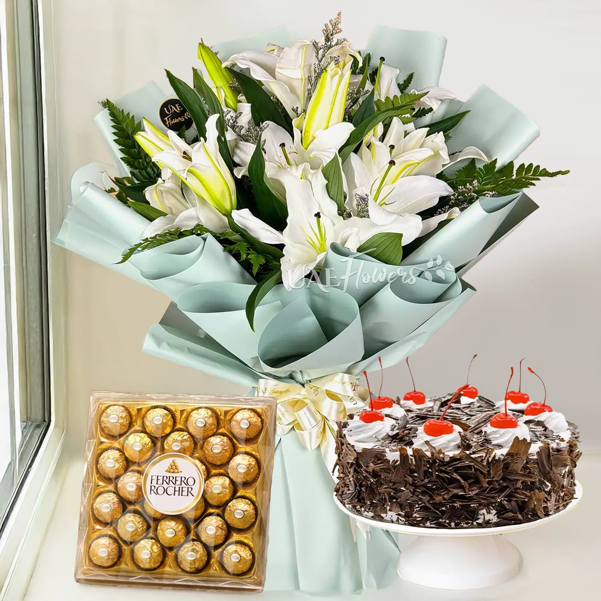 white lilies, black forest cake, ferrero rocher chocolate.