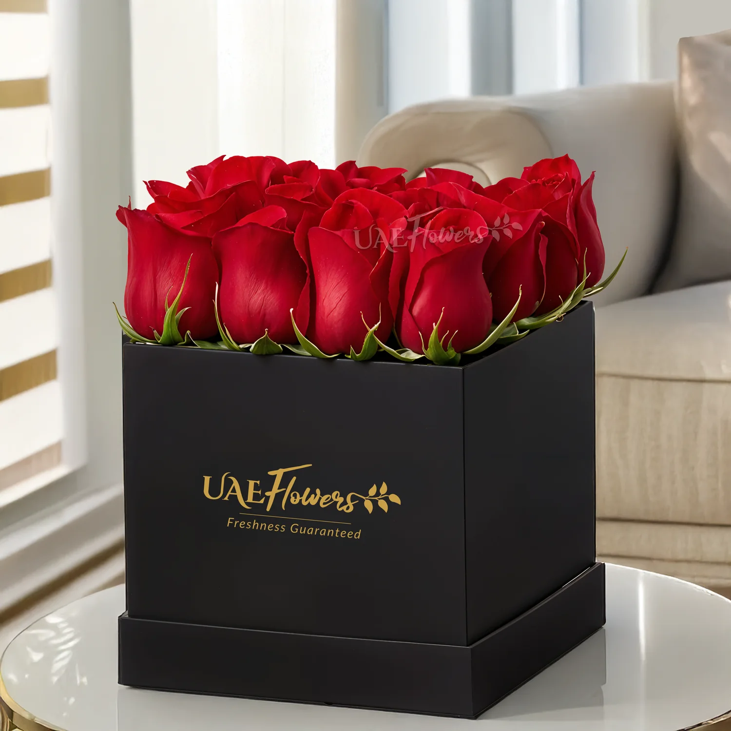 Arrangement of 12 Red Roses with greens in a Box.