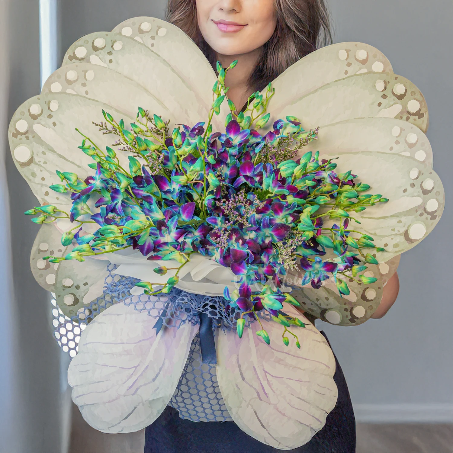 Butterfly bouquet of 20 blue orchids with blue baby's breath fillers tied with ribbons.