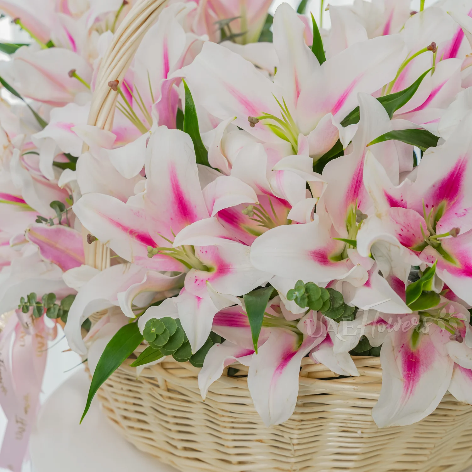 A basket of 30 pink lilies with green fillers.