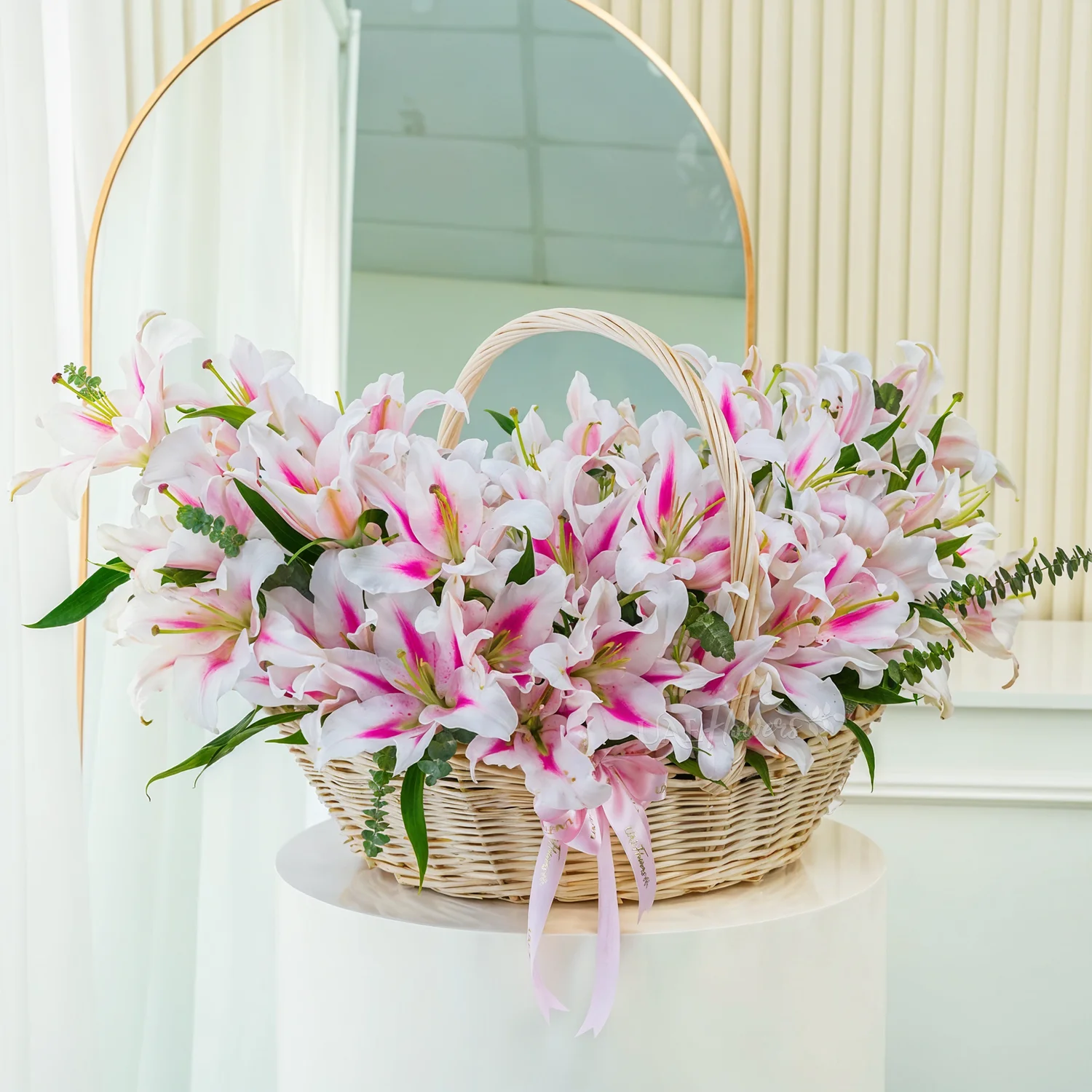A basket of 30 pink lilies with green fillers.