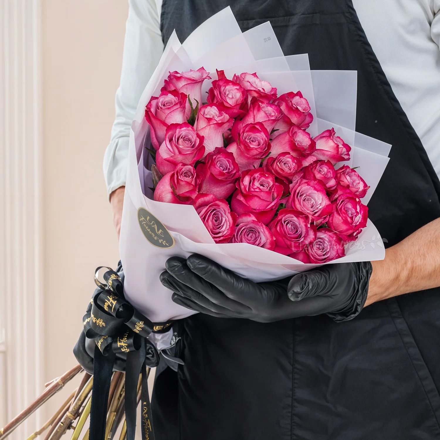 Bouquet of purple roses  with ribbons.