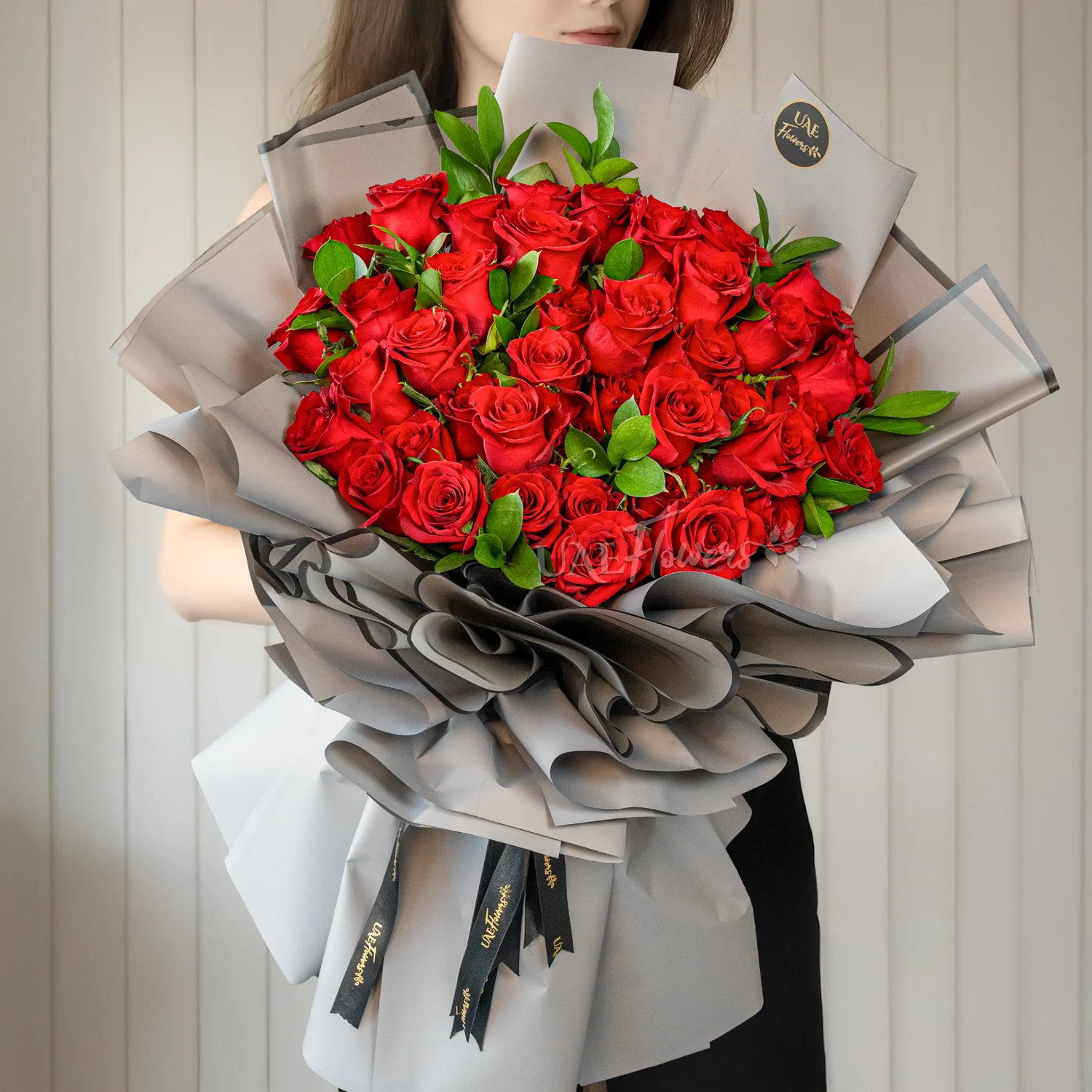 Bouquet of 40 Red Roses with fillers beautifully wrapped in a paper packing and ribbons.