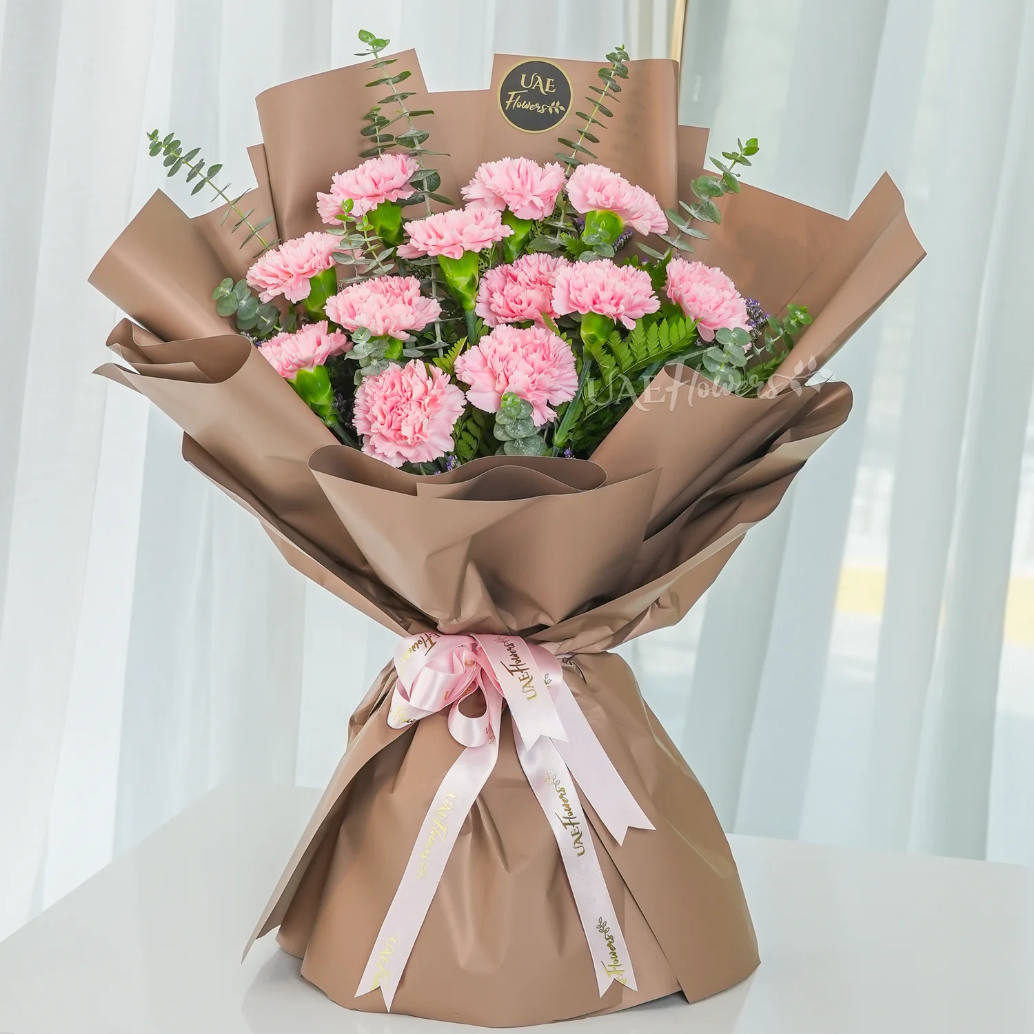 Bouquet of 12 pink carnations.